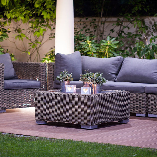 The backyard of a modern residential villa with wicker furniture