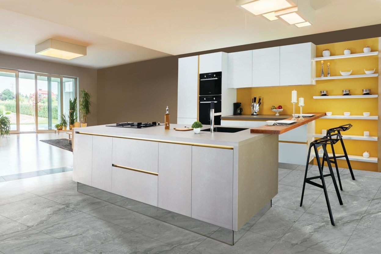 A modern white and gold-themed kitchen